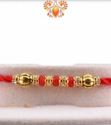 Red Bead Diamond Rakhi with Golden Beads